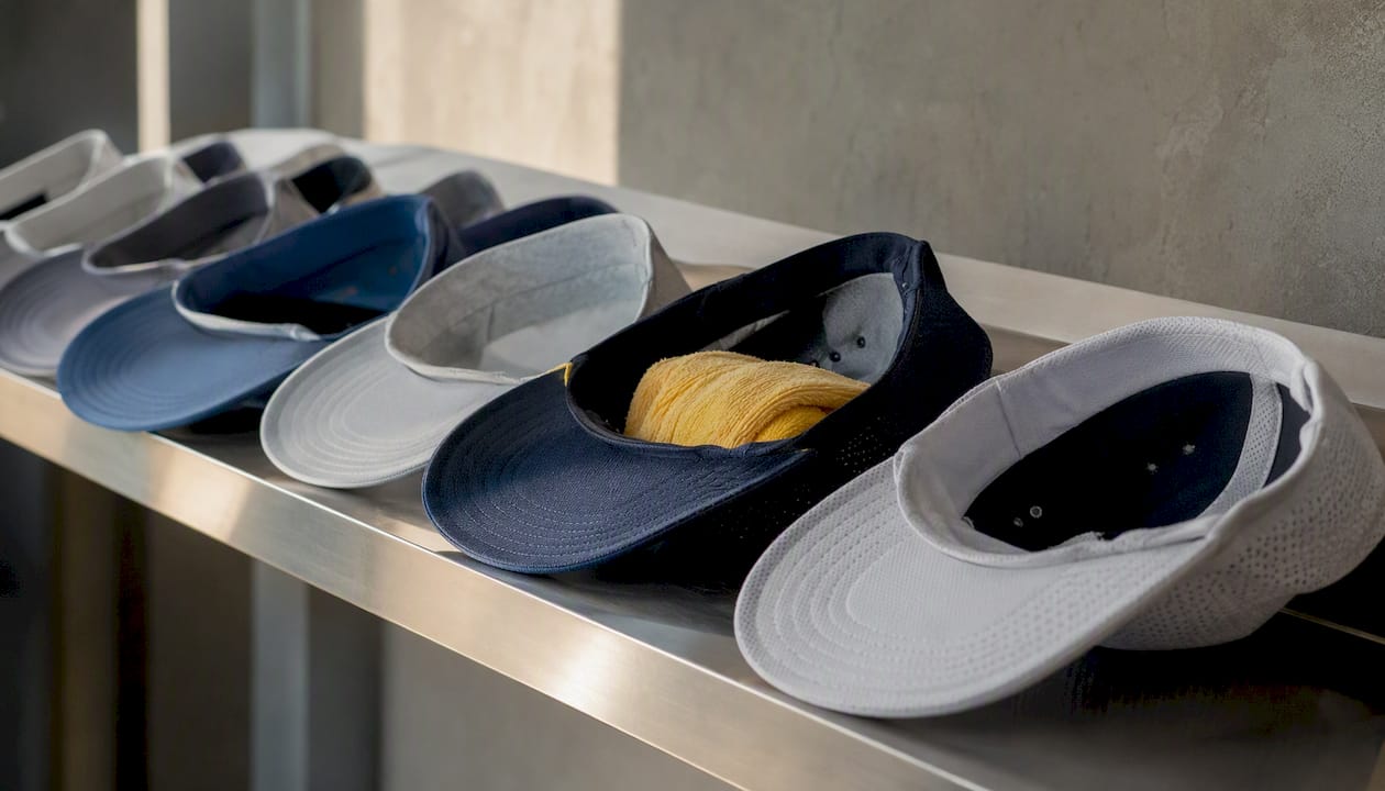 Stored golf caps brim-up with towel inside