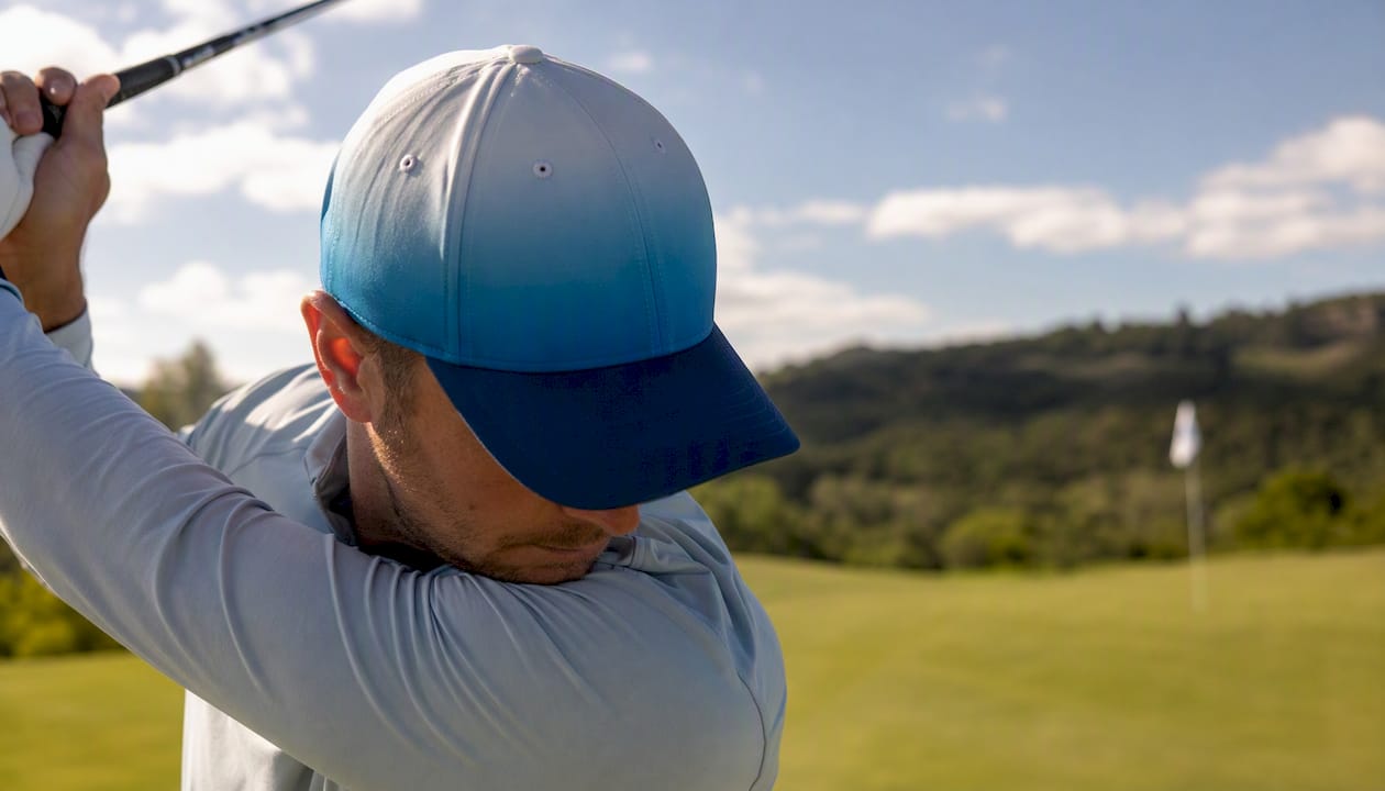 Close-up of gradient golf hat crown and brim on golf course