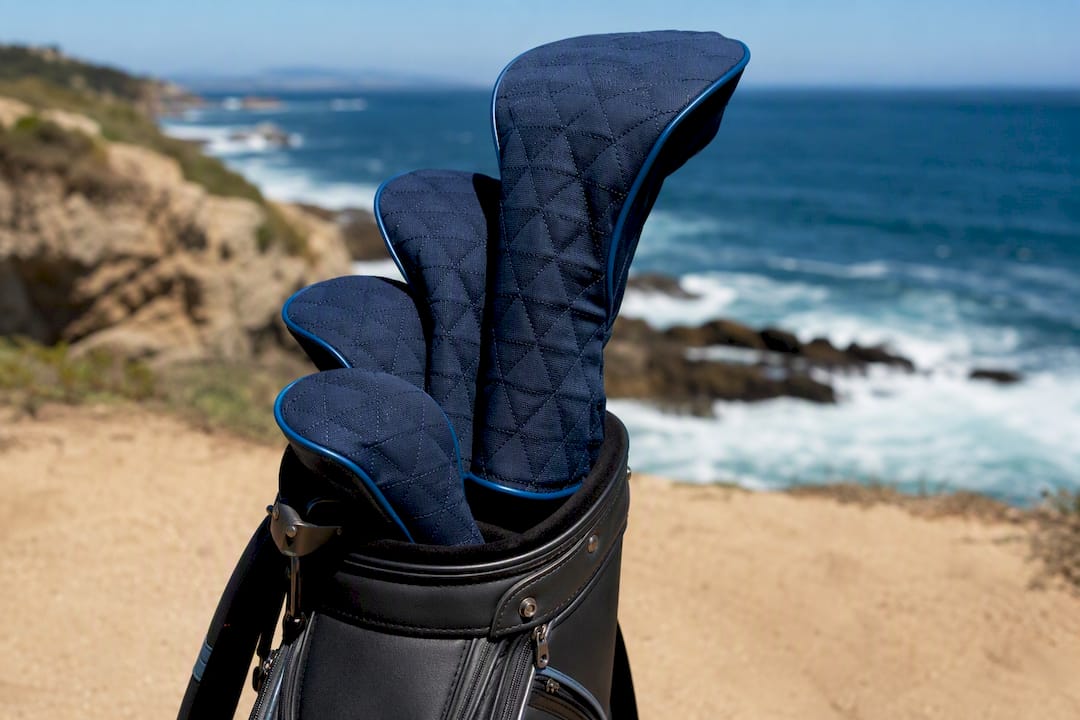 Golf bag with snug-fitting headcovers on clubs