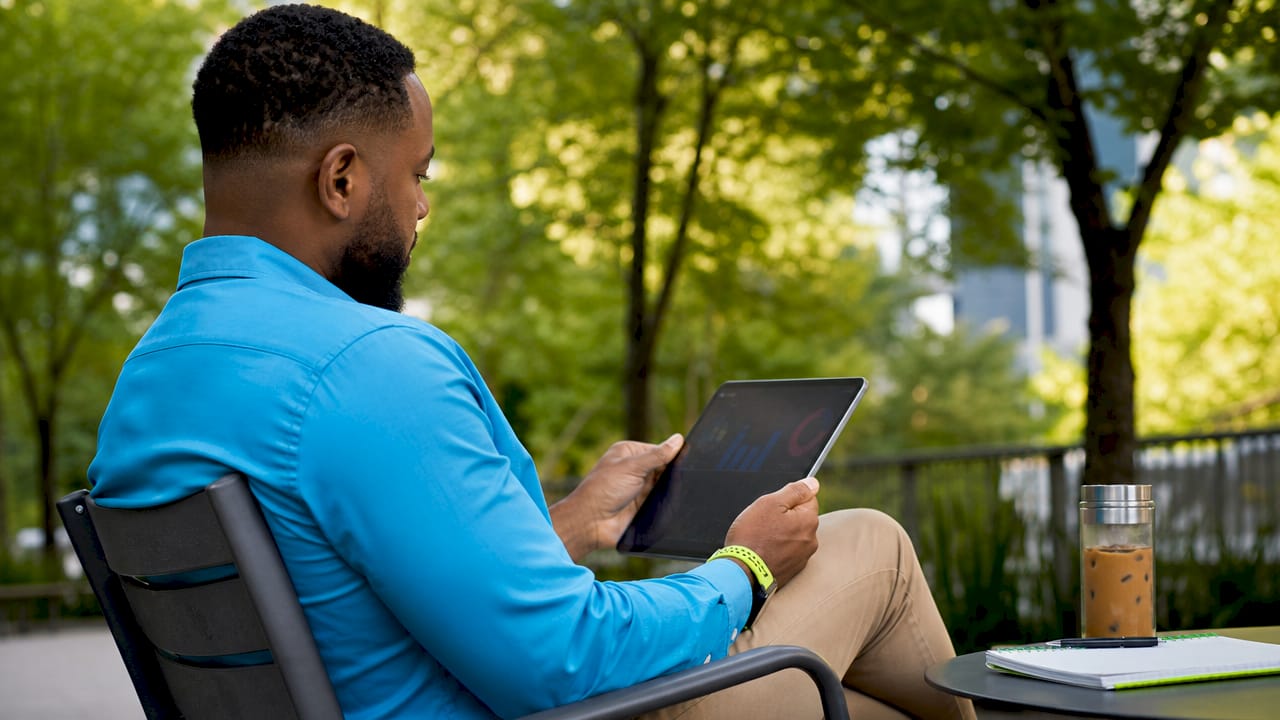Marketer analyzing website analytics tablet