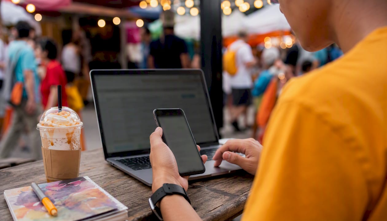 Hands managing social media posts schedule
