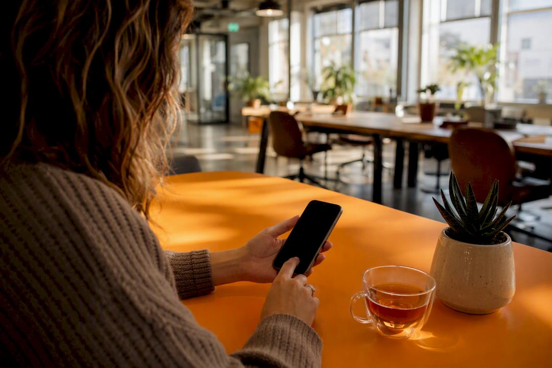 Hands setting Instagram giveaway on phone