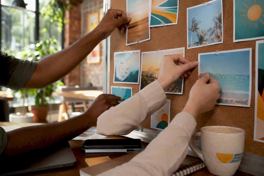 Hands arranging social media campaign prints