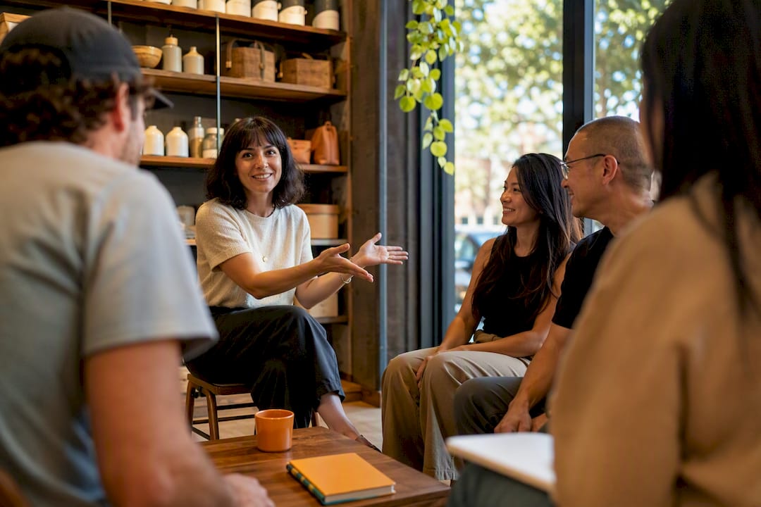 Small business owner facilitating customer conversation