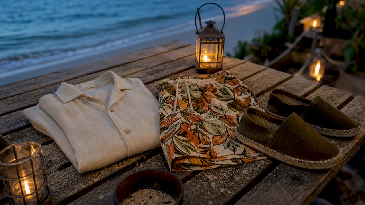Overhead view of elegant beach shirt outfit components