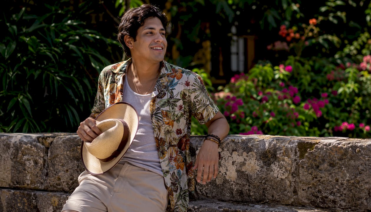 Man styled in tropical print shirt layering