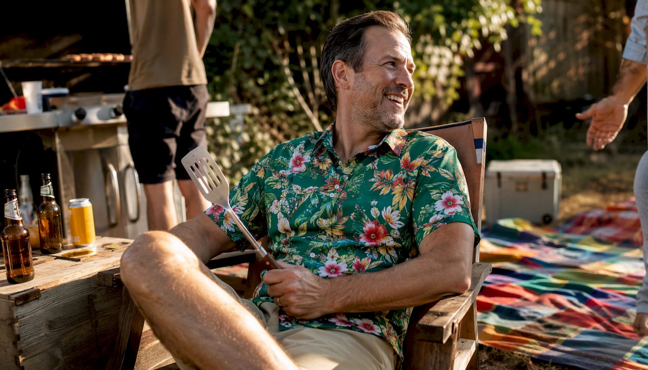 Man wearing Dan Flashes floral shirt at BBQ