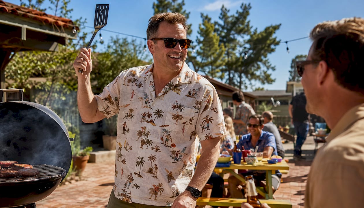 Man grilling wearing Dan Flashes cotton hemp shirt