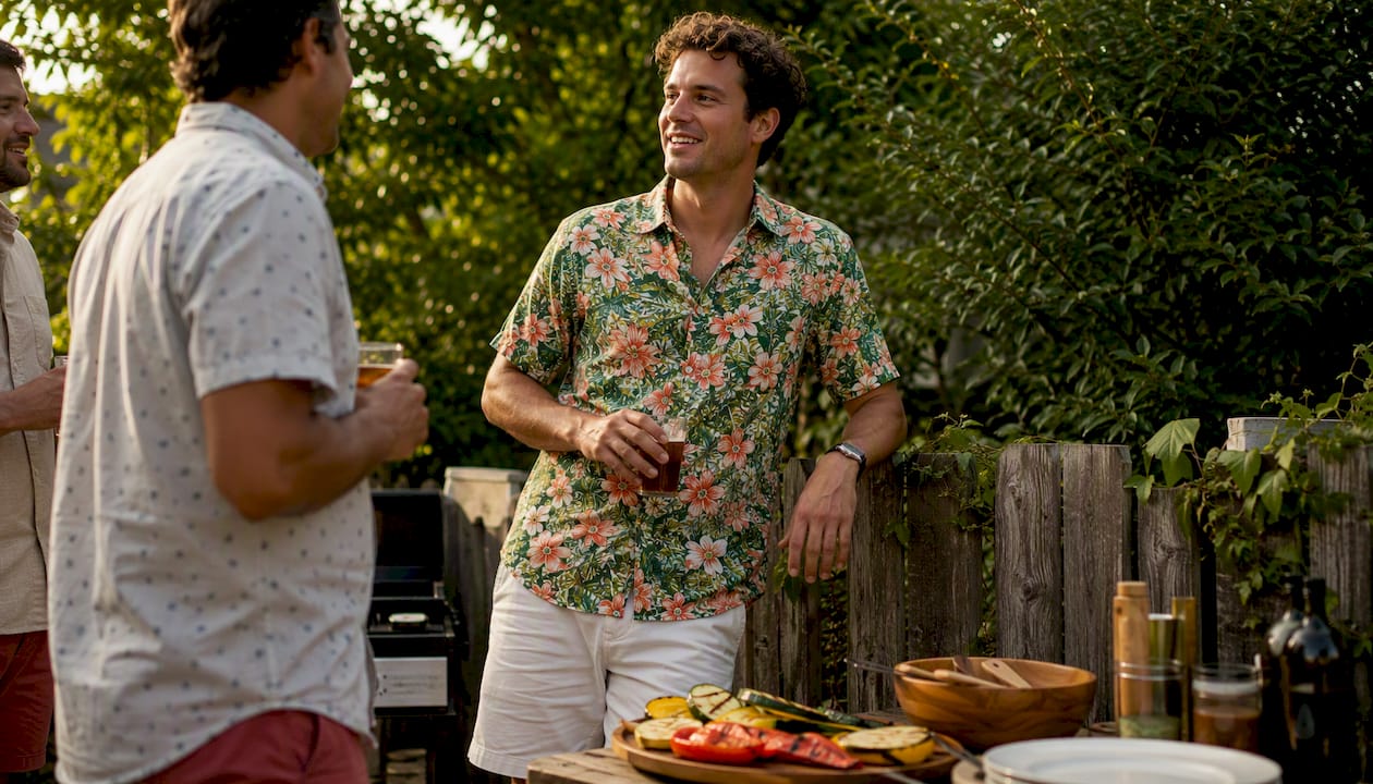 Man wearing Dan Flashes floral shirt at backyard BBQ