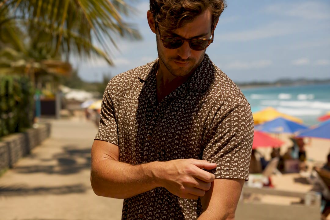 Man touching merino wool blend shirt fabric