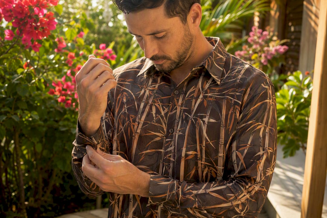 Man adjusting sleeve of bamboo hemp Dan Flashes shirt