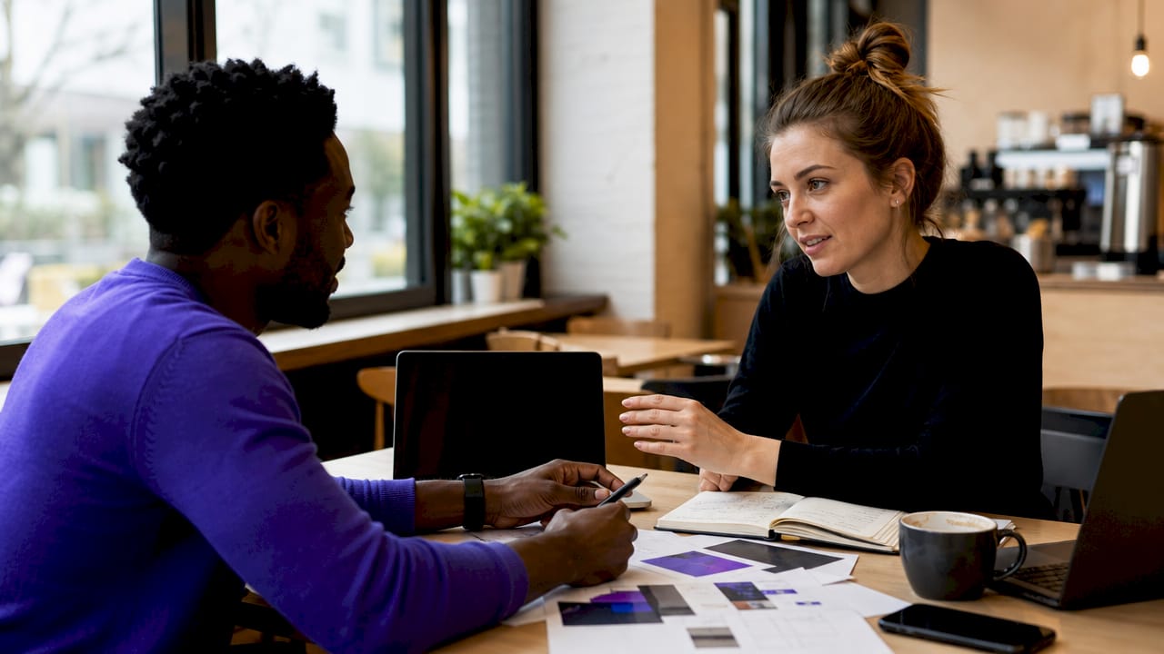Team planning autoresponder setup at meeting table