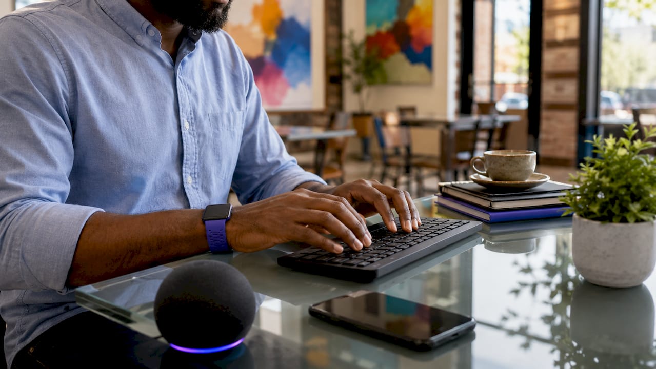 Close-up of hands typing with AI chatbot devices
