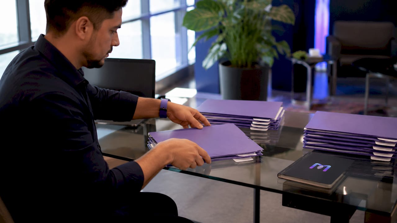 Hands organizing support ticket folders