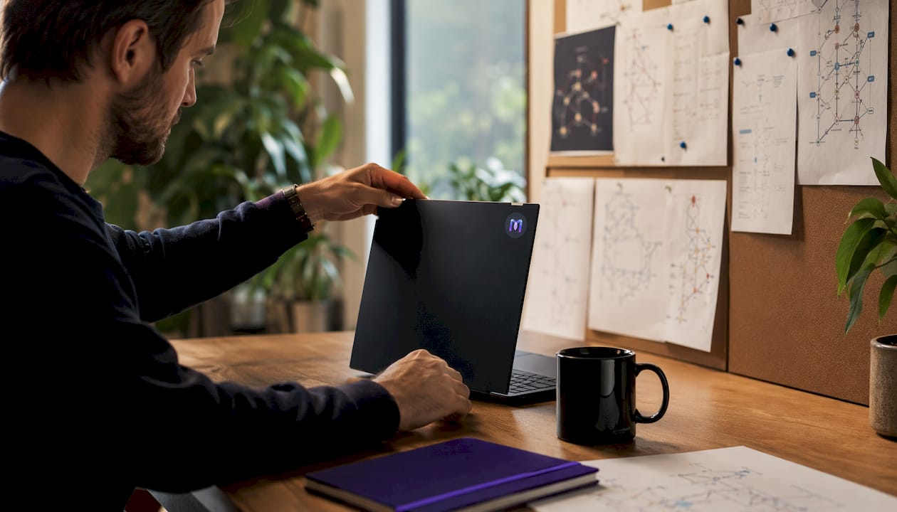 Close-up of hands typing with data flow diagrams