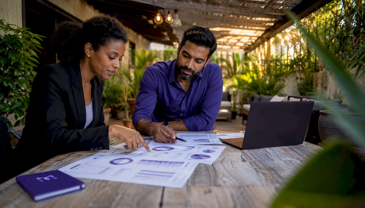 Team leaders reviewing automated QA reports