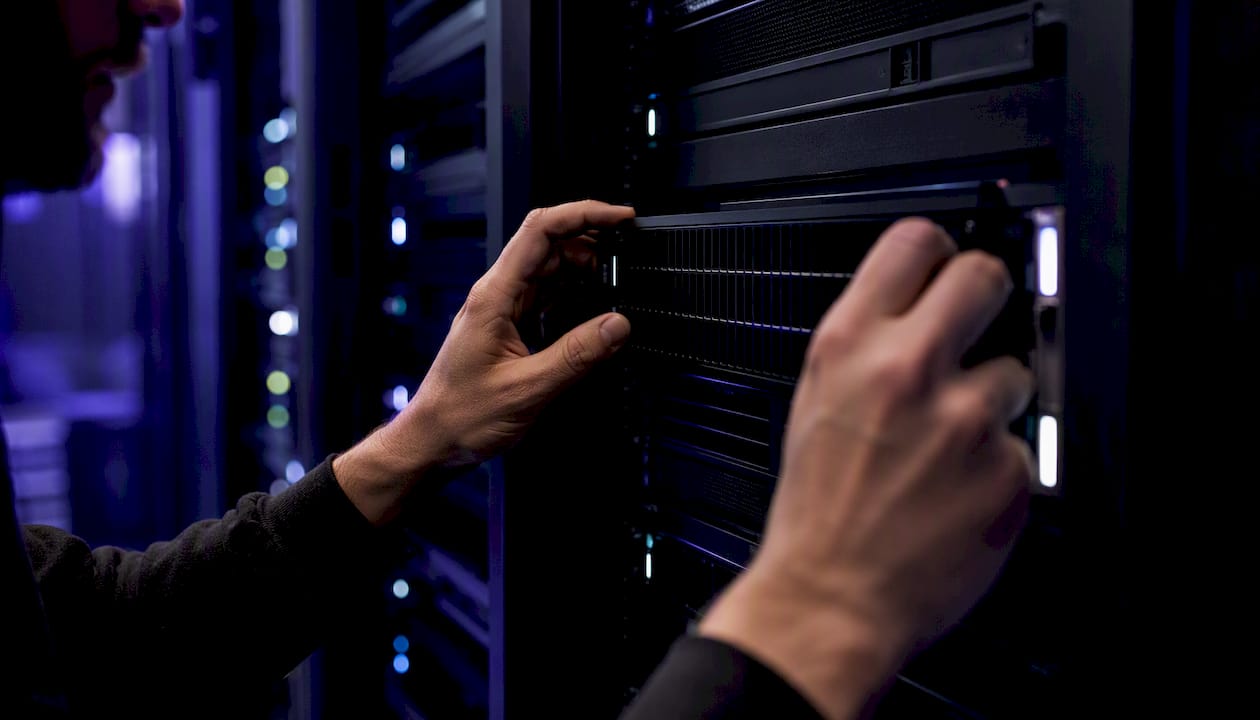 Hands adjusting server cooling vent