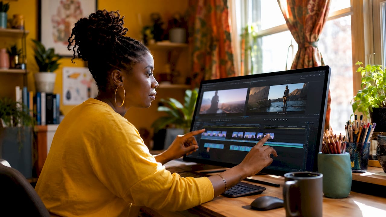 Hands adjusting jump cut clips on editing timeline