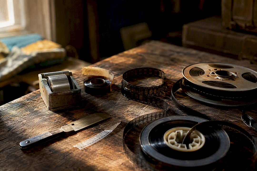 Rustic table with vintage film editing tools