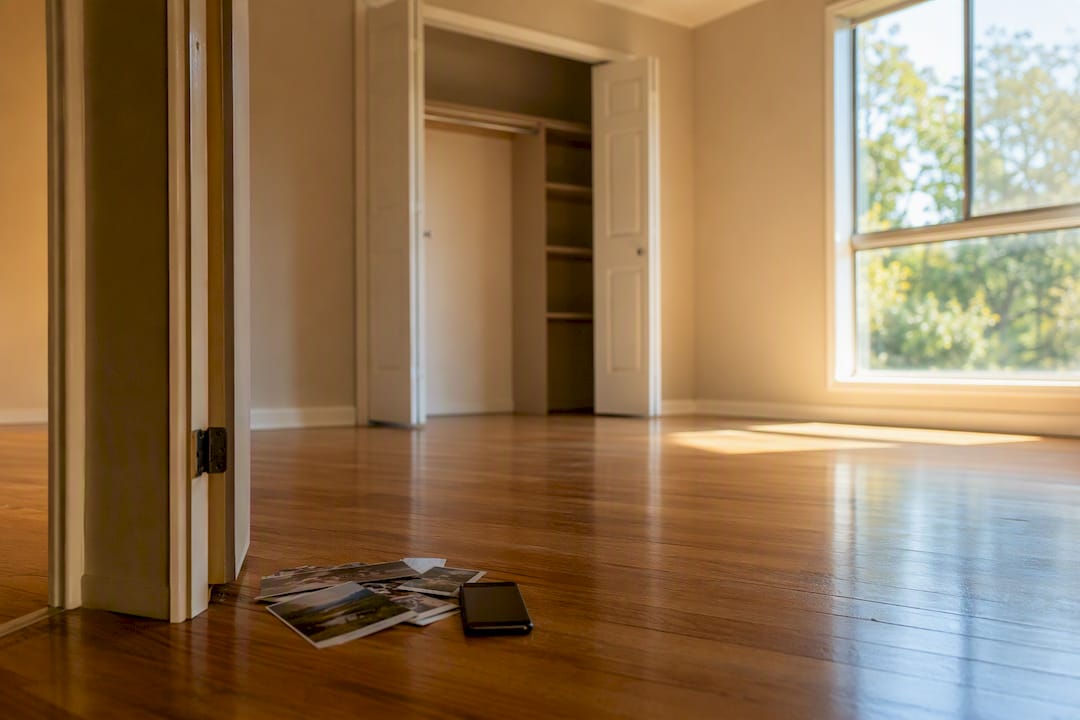 Empty apartment room after move with photo prints