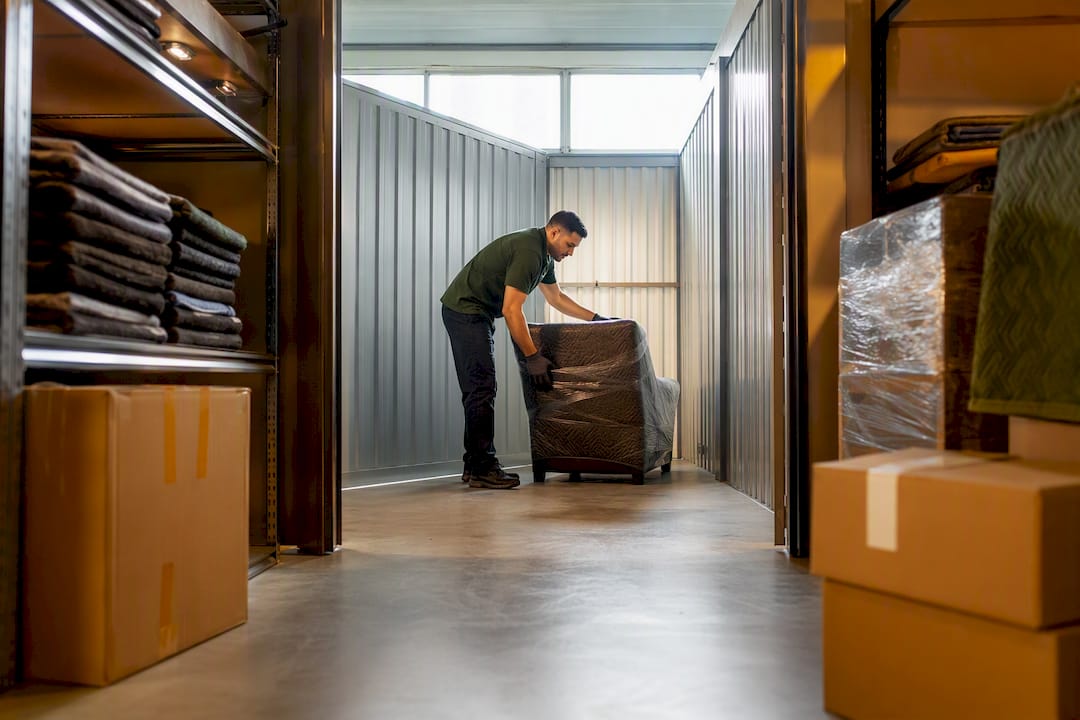 Wrapped household goods staged in warehouse storage