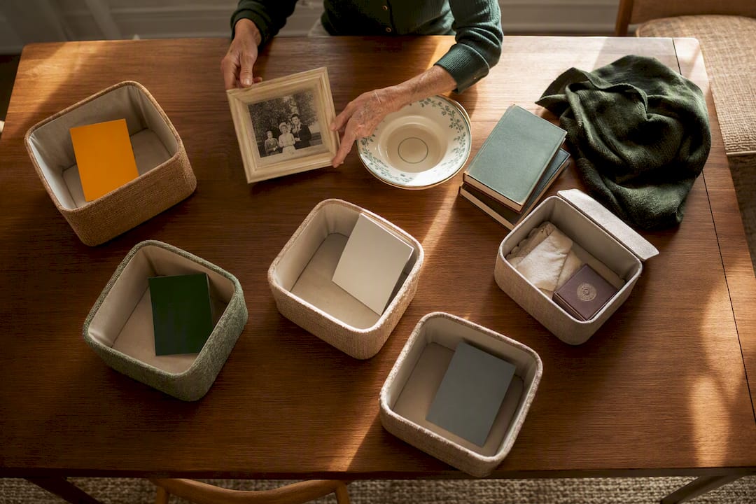 Hands sorting senior household keepsakes