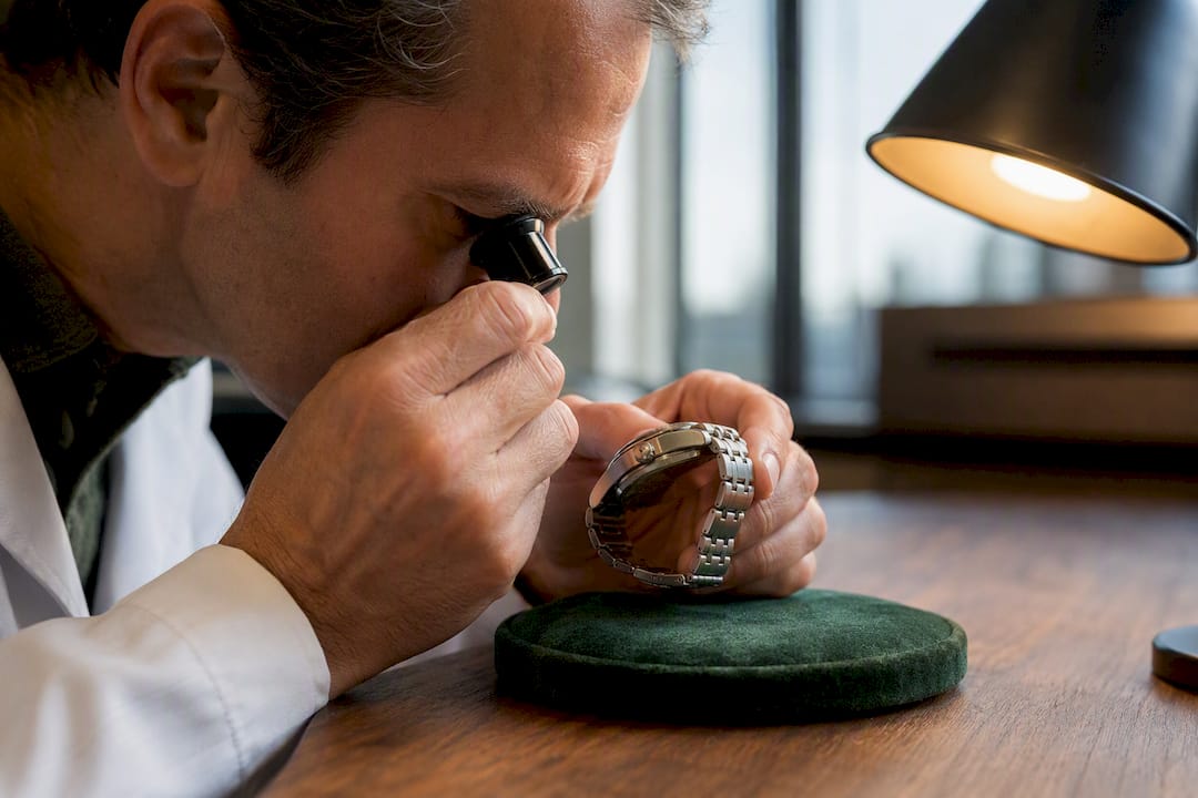 Appraiser inspecting a collectible watch