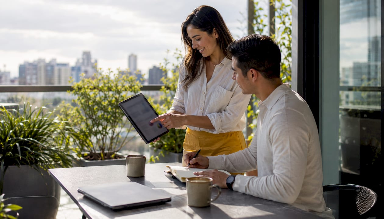 Couple working on paid ads campaign in office