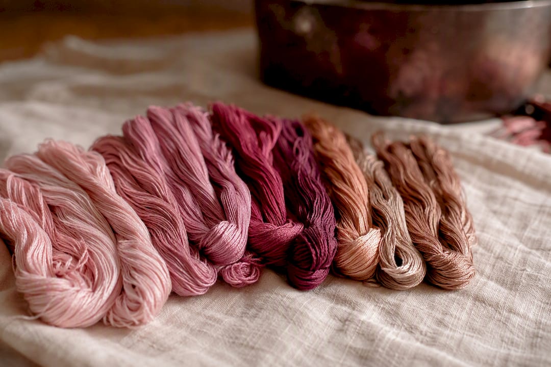 Close-up of embroidery floss skeins showing color shifts