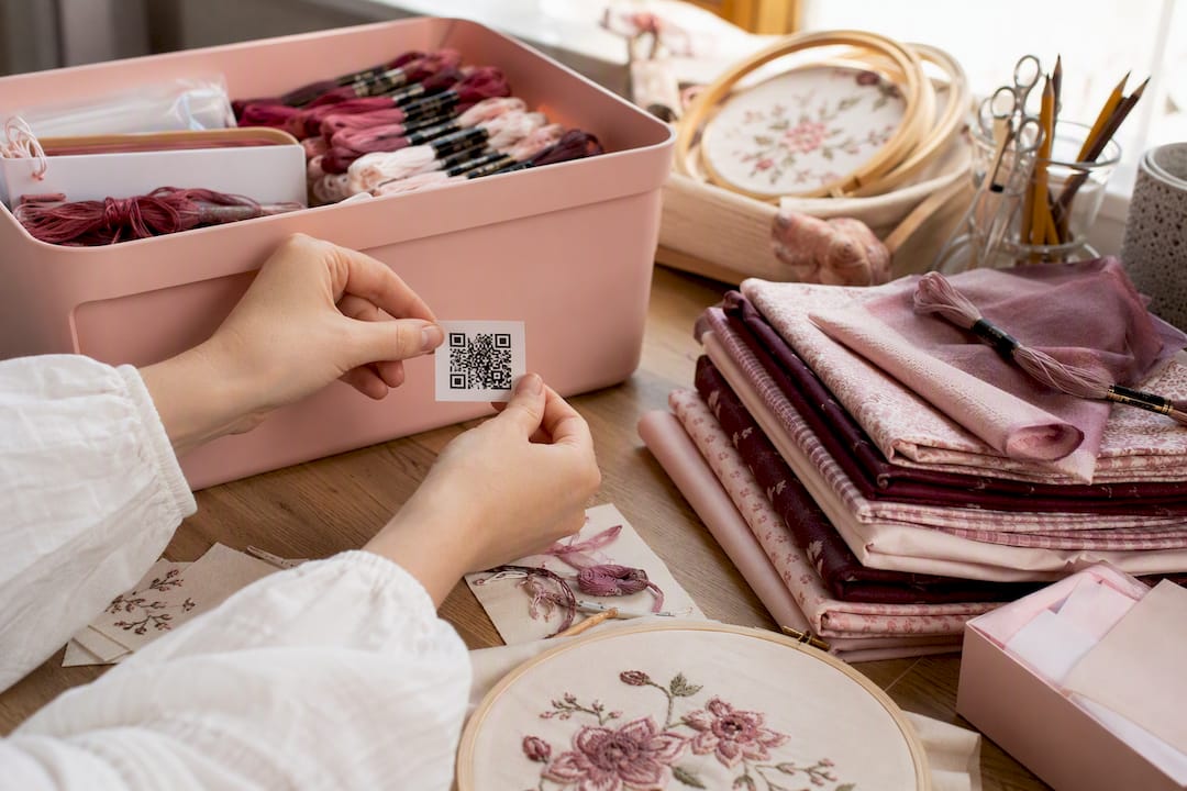 Hand placing QR code on storage bin