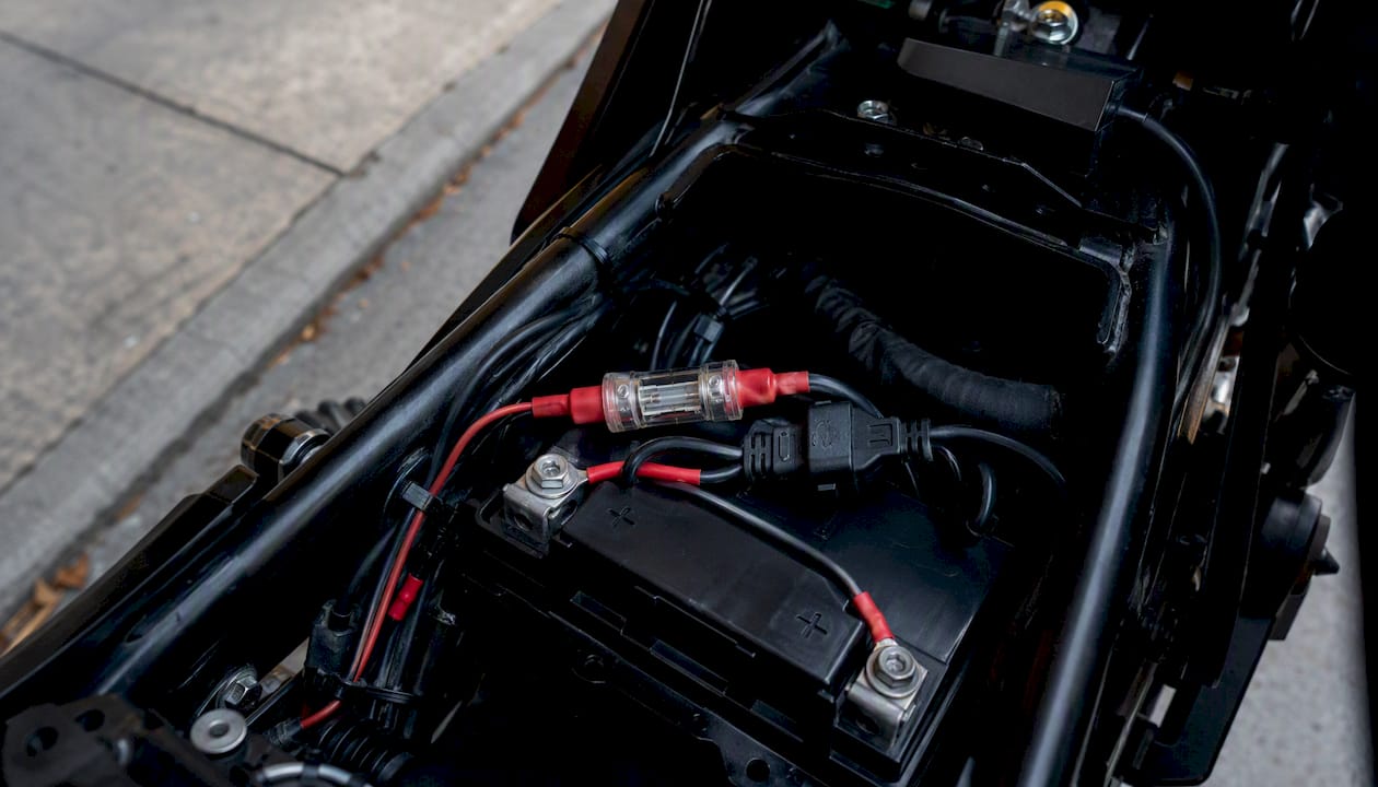 SAE quick-connect harness attached to motorcycle battery