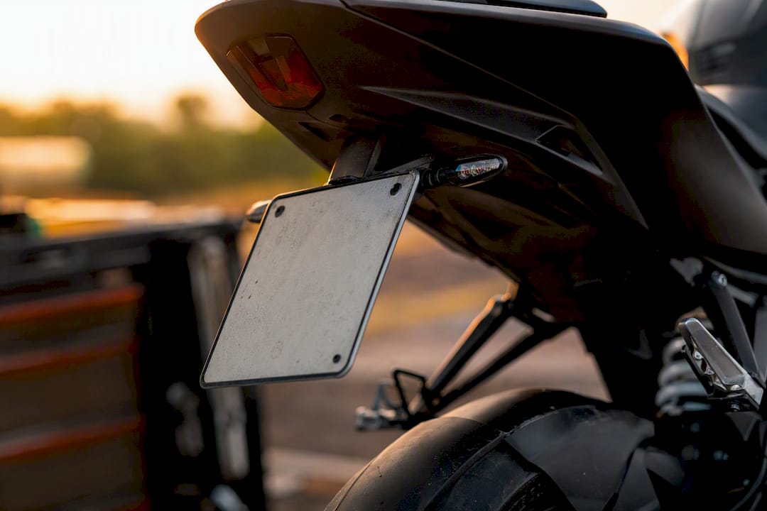 Side mounted motorcycle licence plate close-up