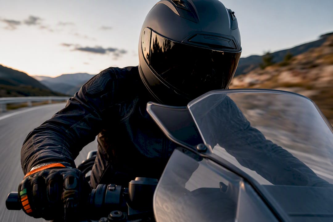 Helmet behind motorcycle wind deflector