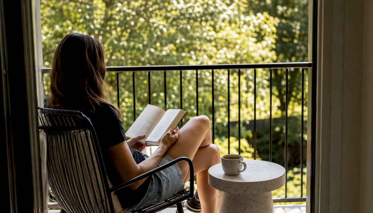Guest casually relaxing on balcony