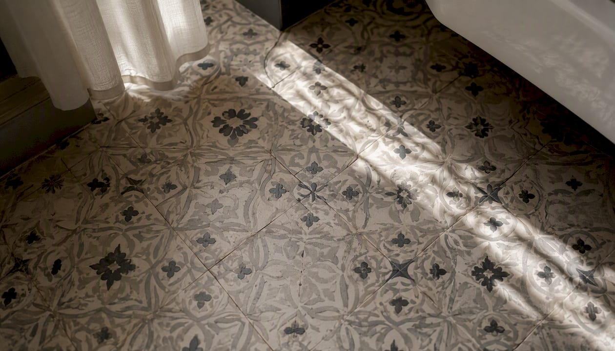 Patterned tile floor repair close-up