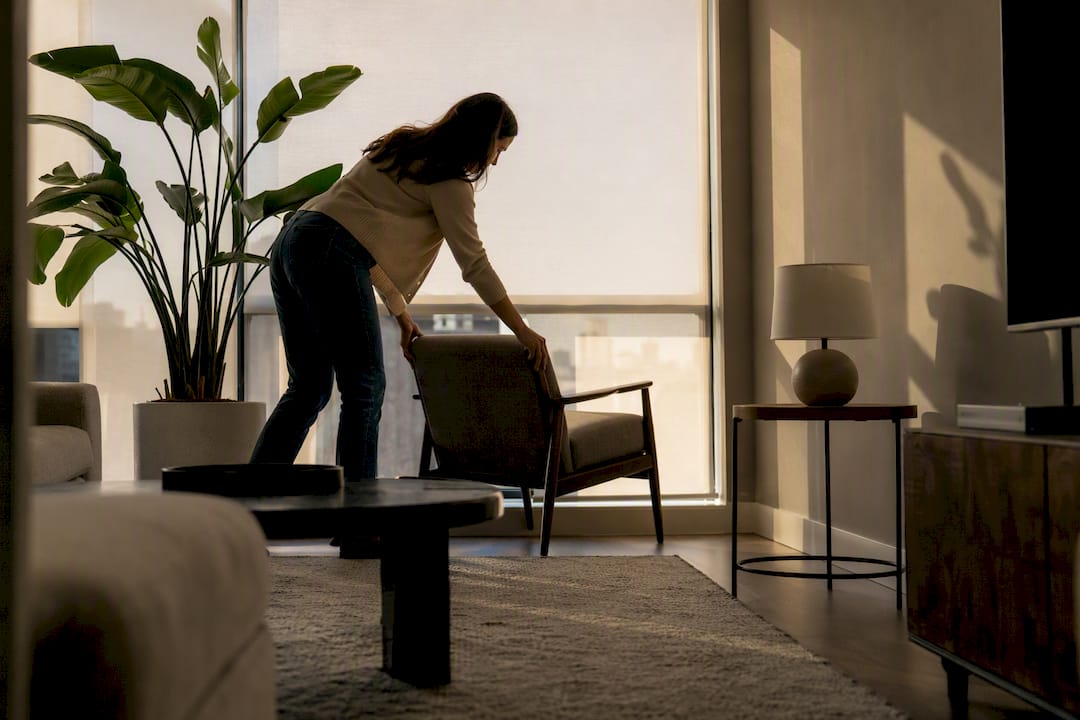 Sunlit rental living room with furniture repositioned