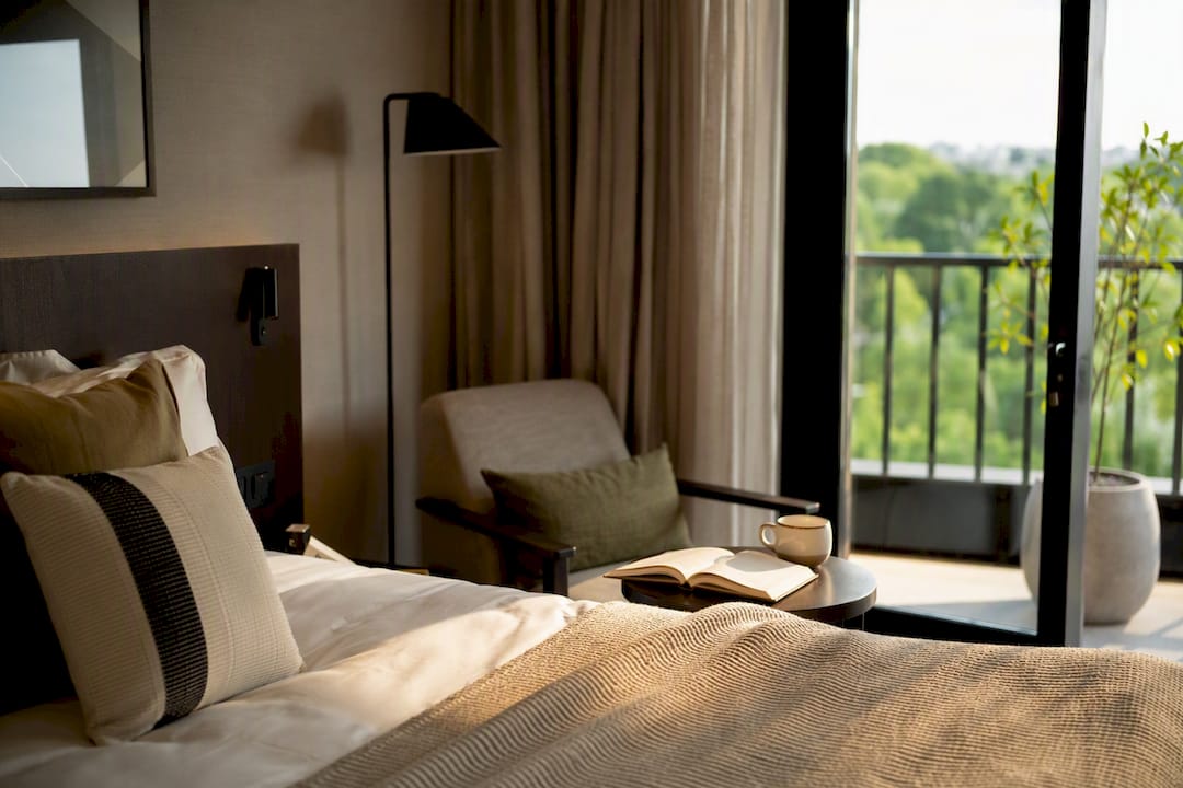 Staged hotel interior with book and coffee cup