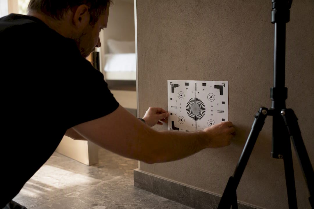 Photographer setting lens distortion test chart