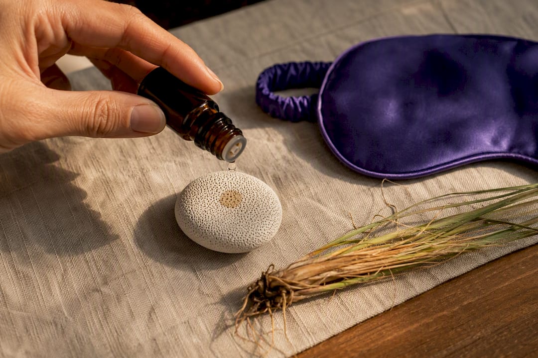 Grounding oil beside a ceramic aroma stone