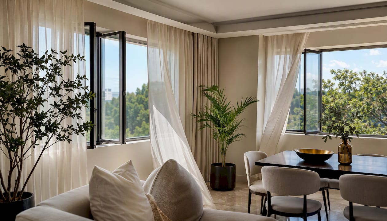Bright dual aspect condo interior with sunlight and airflow