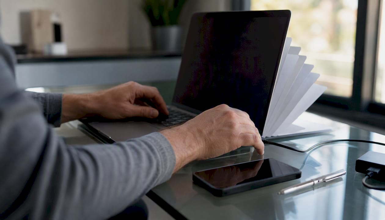 Hands organizing digital evidence files