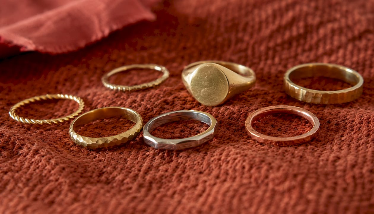 Studio shot of varied ring styles on white surface