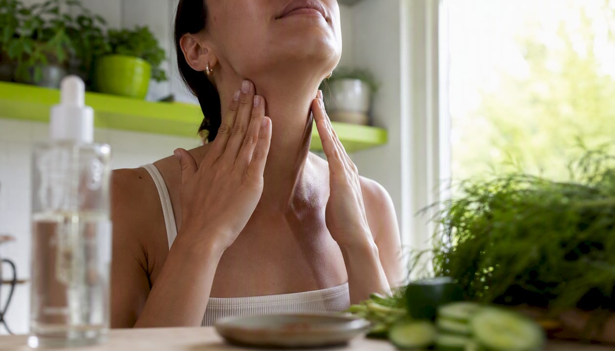 Hands layering peptide serum and moisturizer