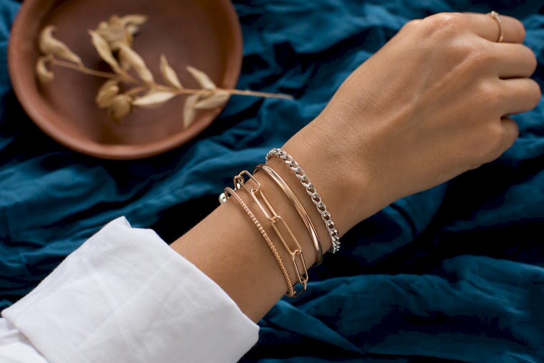 Stylish mixed metal bracelet stack close-up