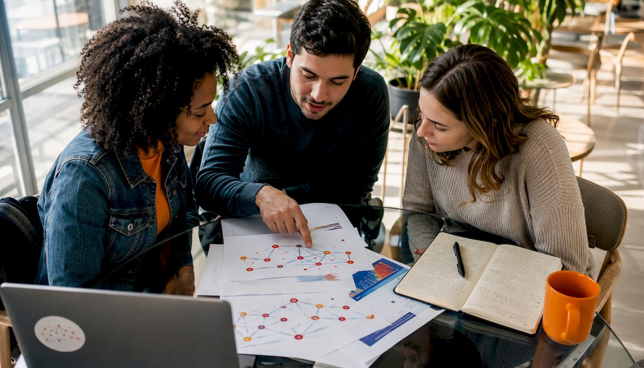 Group discussing cybersecurity mentorship materials