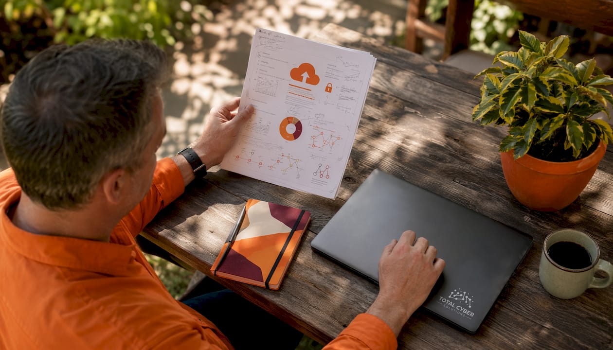 Hands reviewing cloud backup recovery documentation