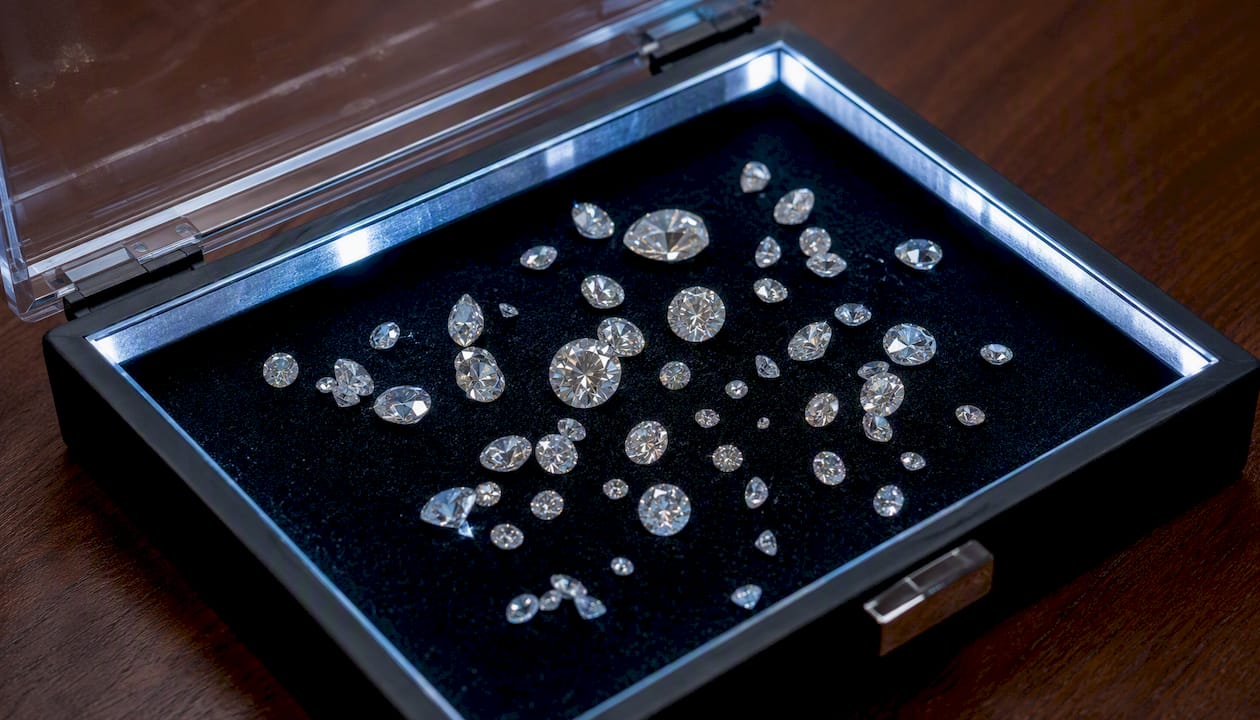 Close-up of loose diamonds in secure container