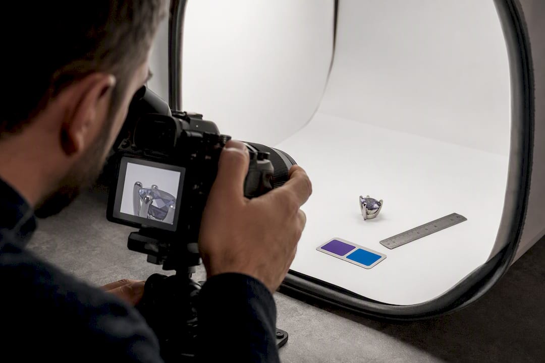 Photographer capturing detailed jewelry product imagery
