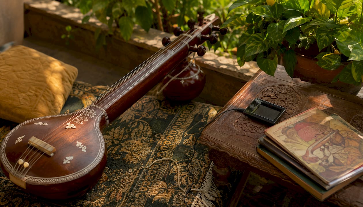 Tanpura instrument with tuner and music books