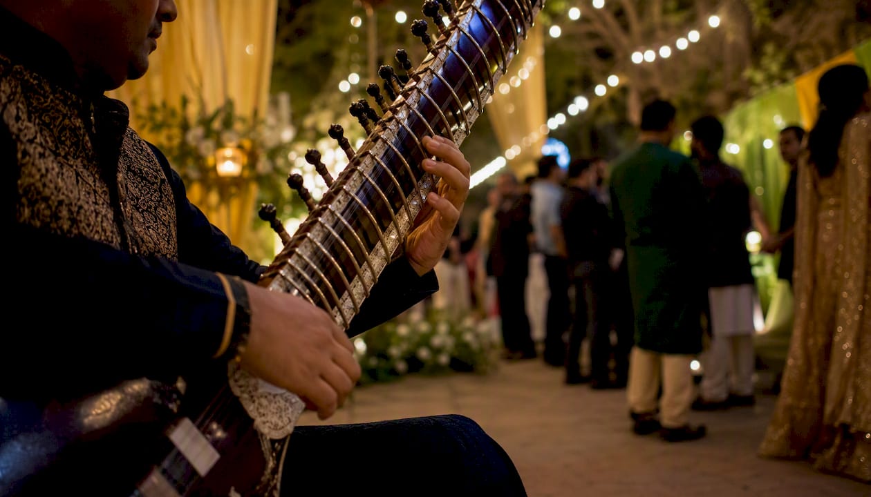 Rajib Karmakar sitarrajib Baraat Music Ideas: High-Energy Playlists & DJ Tips 2 Hands playing sitar at baraat photo stop